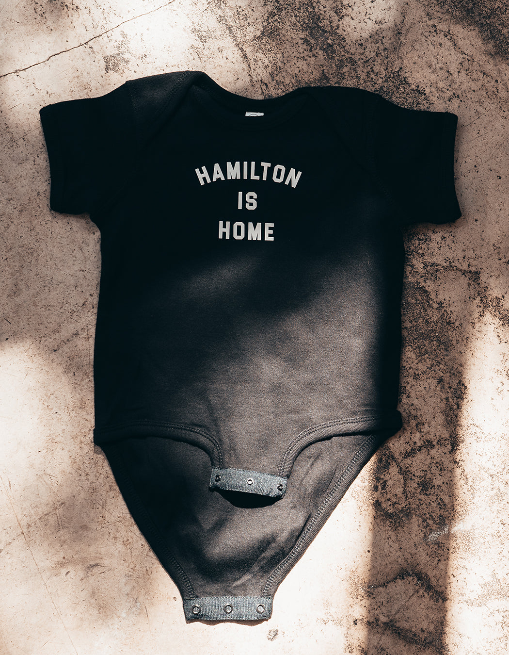 Hamilton is Home Onesies Black – The Hamiltonian - Main Image